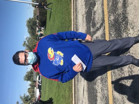 Associate Principal Mr. Meany promotes the University of Kansas Jayhawks on College Wear Wednesday on Oct. 27. 