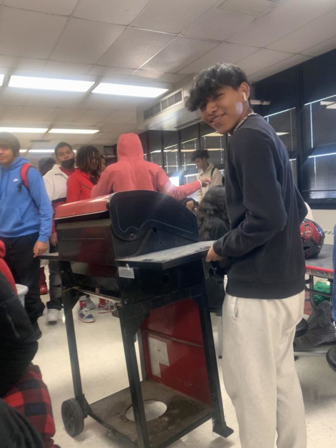 Bremen+student+David+Santiago+wheels+around+a+grill+to+carry+his+belongings+on+Anything+But+A+Backpack+day.+On+this+spirit+day%2C+students+tapped+into+their+creativity+to+use+non-traditional+items+to+carry+their+books+and+iPads+throughout+the+school+day.