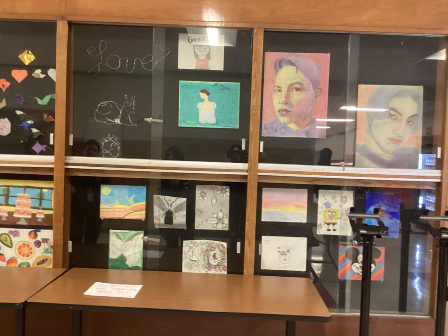 Student artwork is displayed at Bremen High School near the bus doors and school store to showcase the hard work of the art classes.