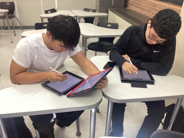 Sophomore mathletes Phuong Phan and Osvaldo Carranza-Barrios practice polynomials after school in room 131 for their Mathletes competition. 