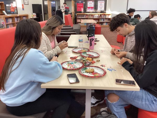 Back to December: Members of the Taylor Swift Club make friendship bracelets at their Dec. 14 meeting in the IMC. This new club brings together Swifties from across the school community. Please see Ms. Tacchi for more information.