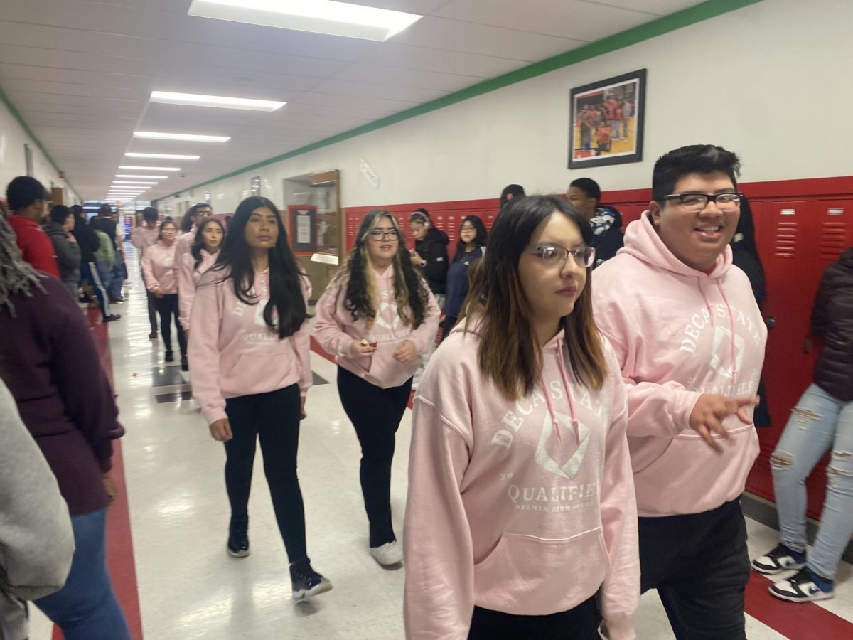 Members of Bremens DECA organization parade through the halls on Feb. 29 as the drumline gives them a send-off to the state competition. About 50 students qualified for the state event, with winners advancing to the national competition. 