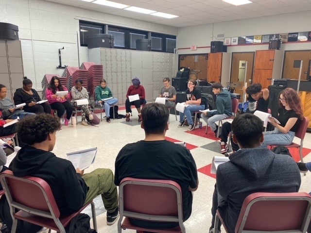 The cast of the fall play "El Luchadores" reads through their script during play practice Sept. 24 in the band room. The cast and crew will spend the next few weeks rehearsing and preparing for their shows, which will be performed in the main gym at the end of October. 