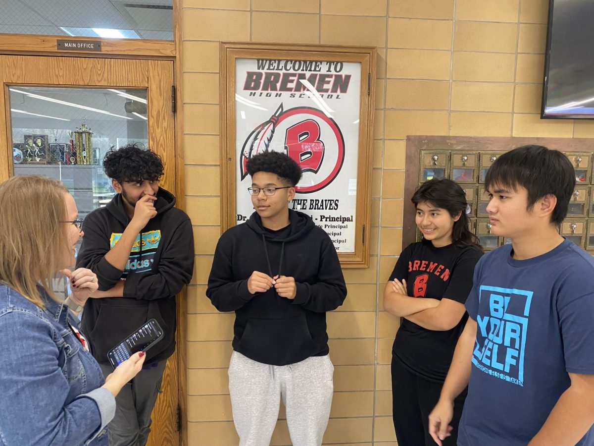 Mrs. Bogard provides direction to Mathletes members Rayyan Vohram Noah Nelson, Nataly Hernandez, and Phuong Phang who devoted their Nov. 19 practice time in order to volunteer for the 40th Annual Bremen Food Drive. The Mathletes members helped pack the donated food into boxes to be delivered to local food pantries.