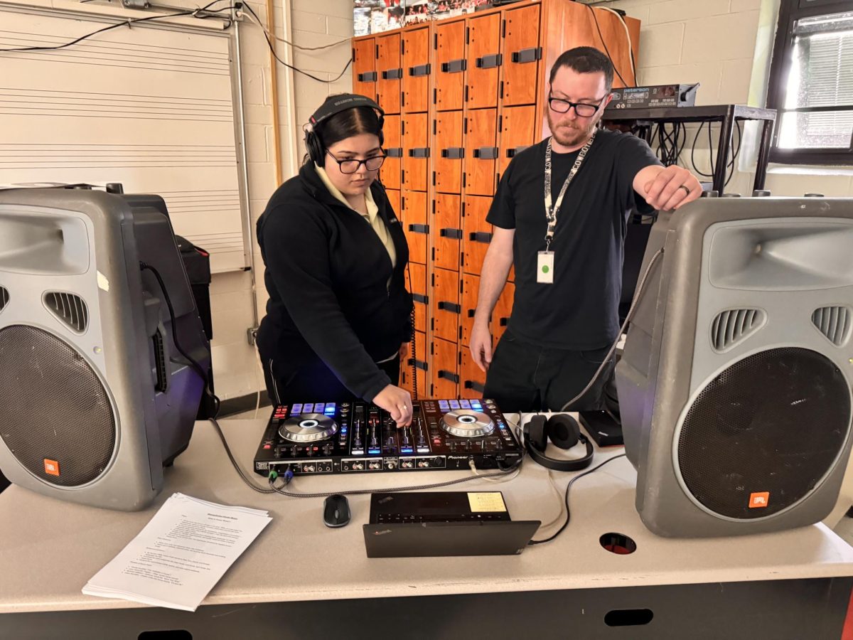 Mr. Rowley experiments with DJ equipment as he shows students how to mix music. In this April 30 Braves Beyond the Classroom session, students also learned about the history of house music and software DJs use in clubs around the world. 