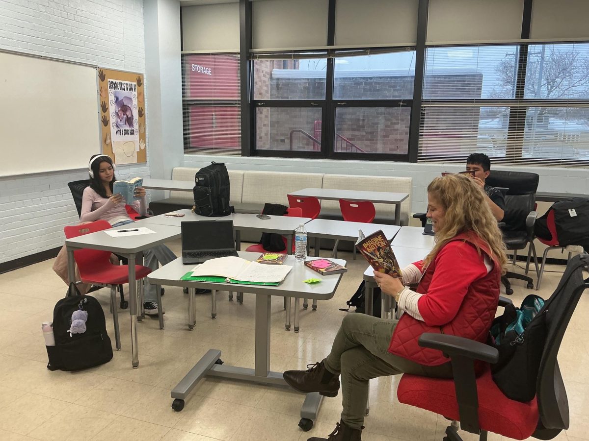 Mrs Ignelzi, Circle Book Club sponsor, leads her crew in silent reading at the meeting at BHS on Dec. 9th. The club is also hosting a Holiday Raffle; anyone interested in purchasing a raffle ticket can see Mrs. Ignelzi or any Circle Book Club member.