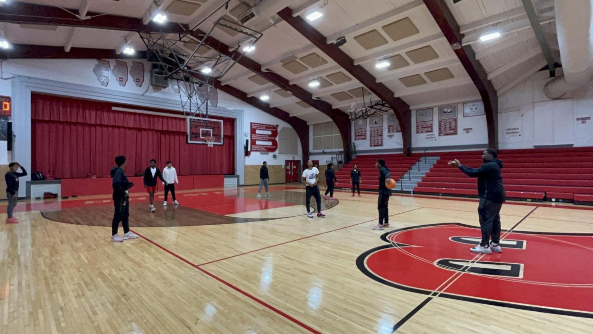 The Braves boys varsity basketball team warms up before their game Jan. 13  against Argo High School at Bremen High School. 
