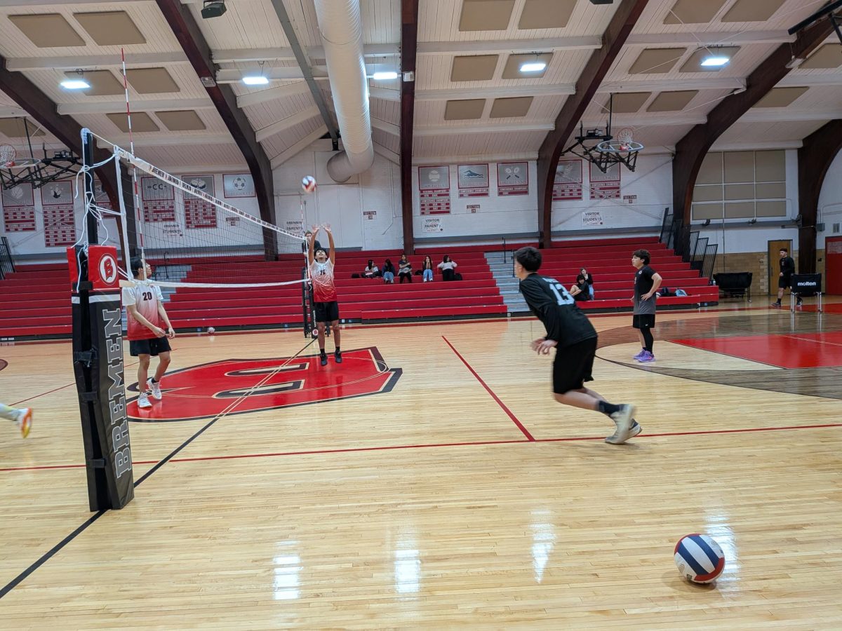 Members of the Bremen Boys Volleyball Team sharpen their setting and footwork during pre-game warmups. With the home court advantage for their March 31 matchup, the Braves are looking to dominate the net.