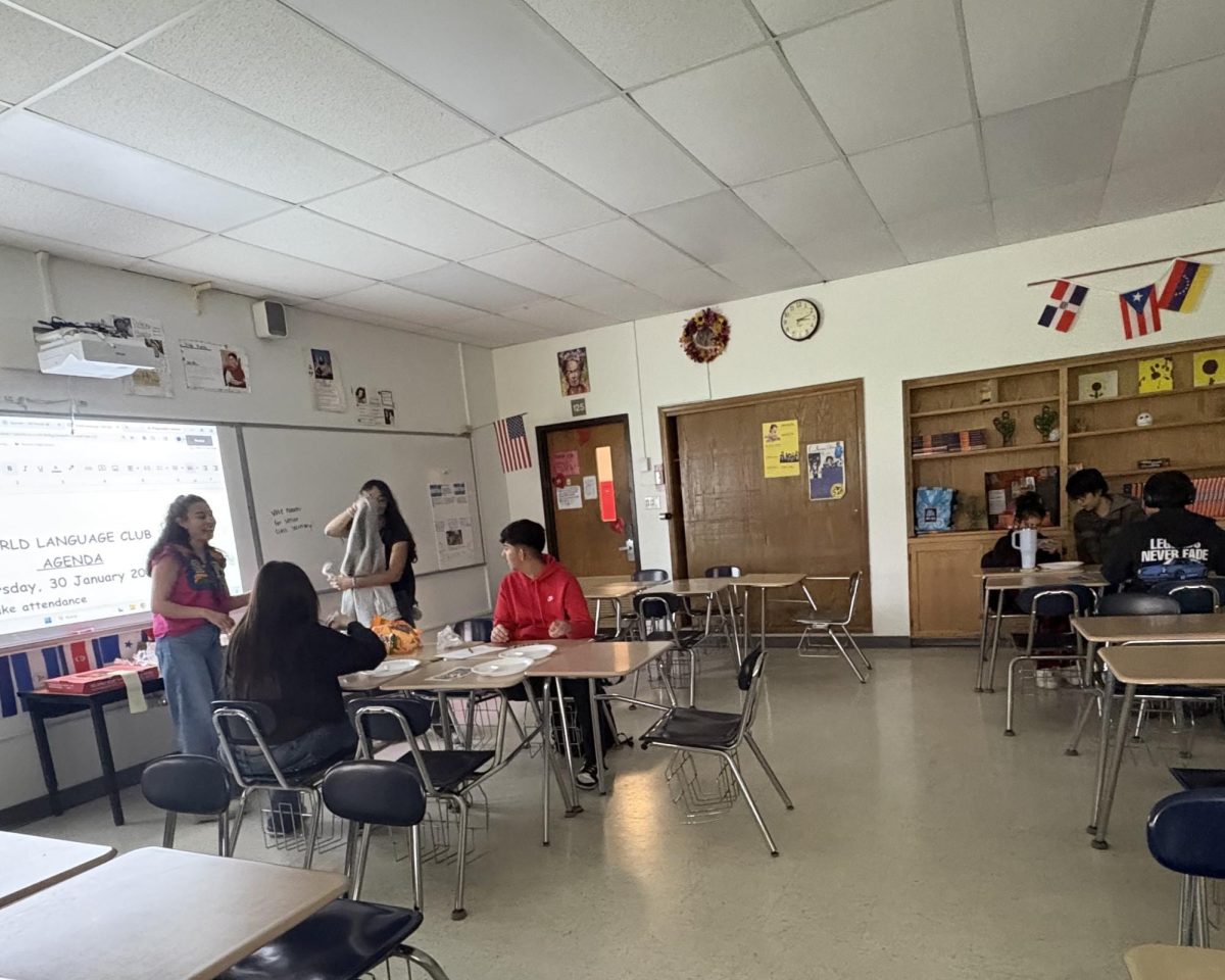 World Language Club, sponsored by Ms. Barban, cheerfully celebrates their final meeting of the school year May 5 with pizza and a few games of loteria in room 125.
